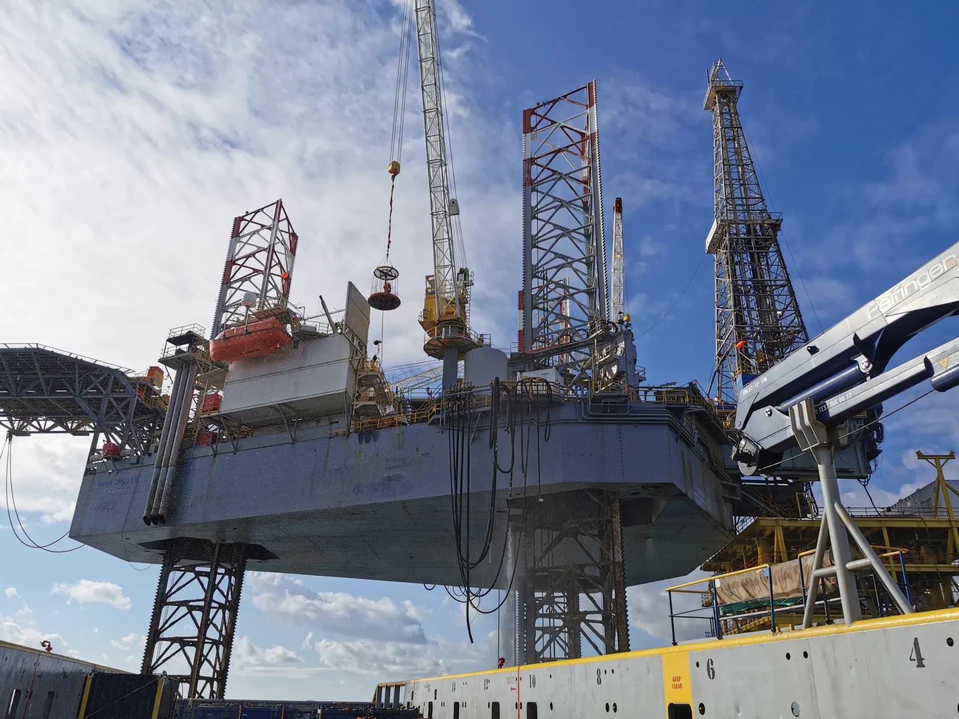 Close-up of a jack-up rig with crane during mobilisation